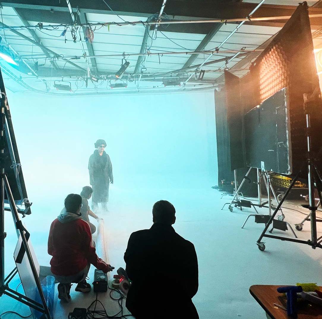 Small crew filming a music video on the infinity cove at Cineview Studios