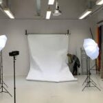 Photography studio hire with white backdrop, soft box lights, and professional studio space prepared for photoshoot