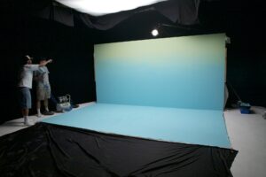 Crew preparing a blue constructed set at Cineview Studios