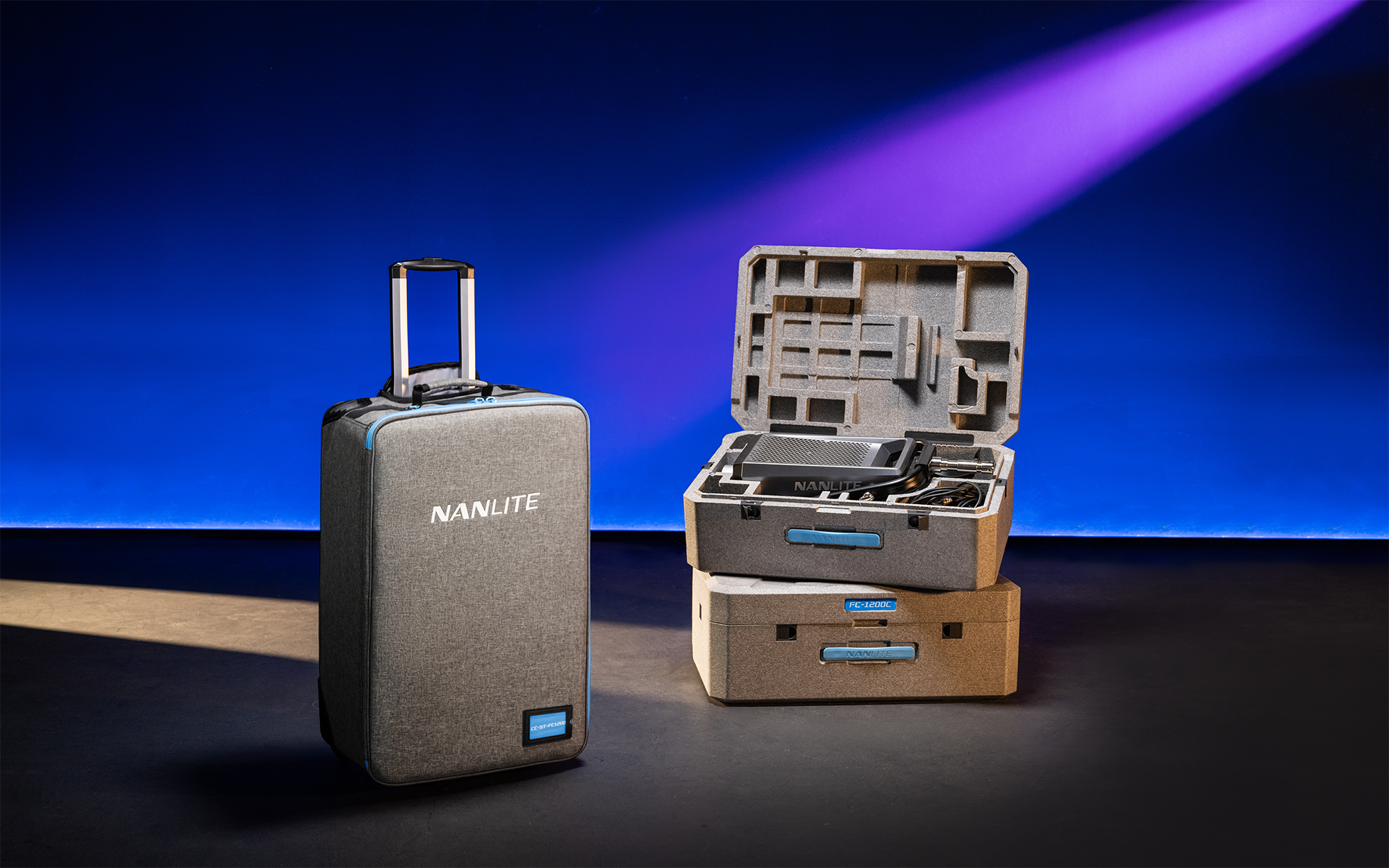Nanlite FC-1200 spotlight in a hard-foam case beside the optional rolling case