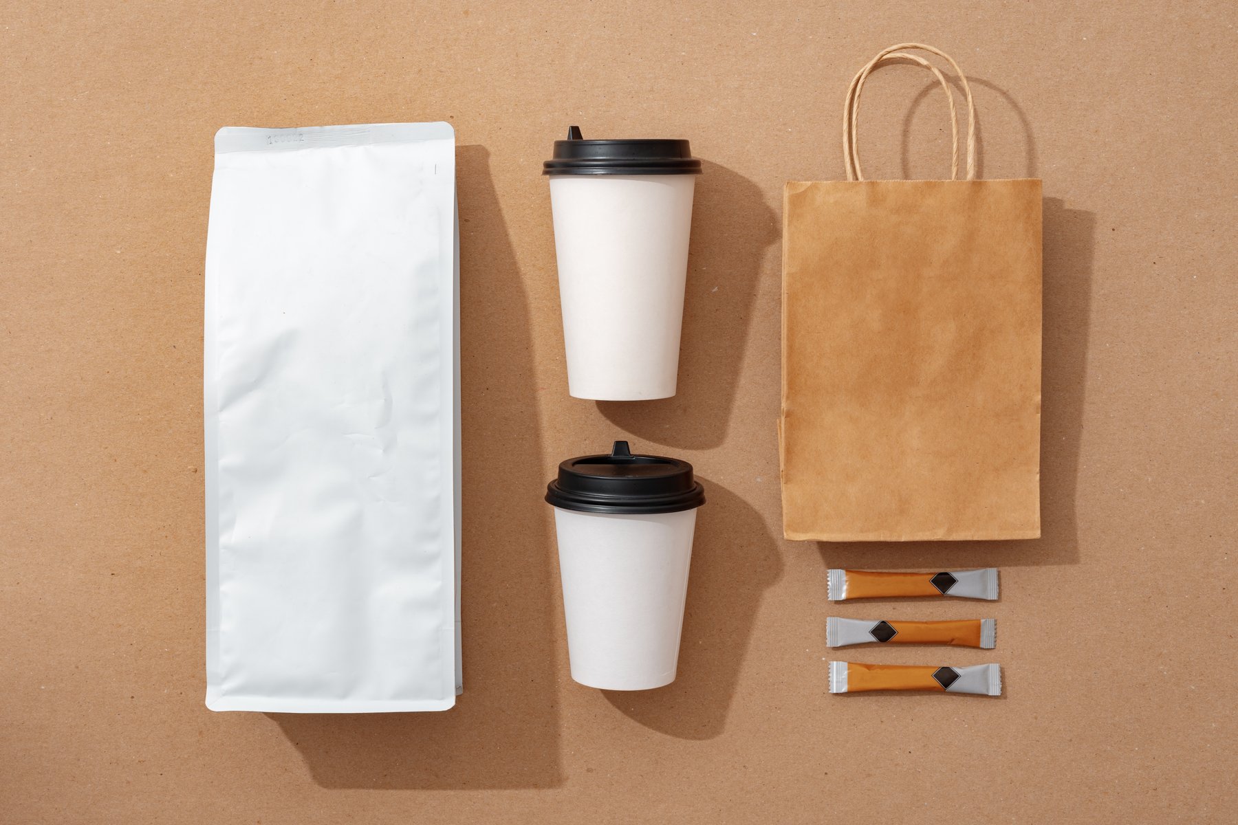 Coordinated coffee packaging arranged as a flat lay