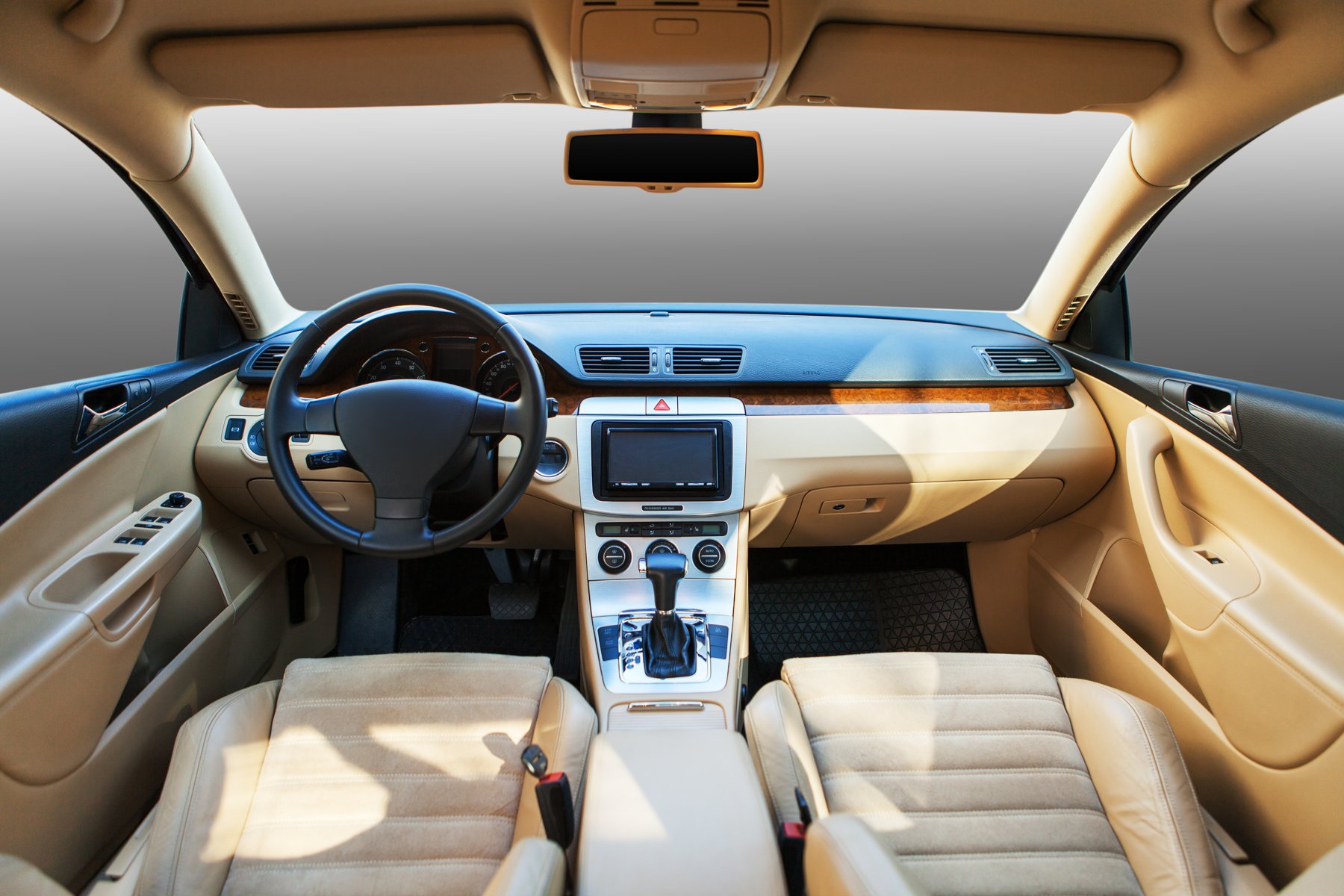 Wide view of a vehicle cabin showing seats, dashboard and centre console