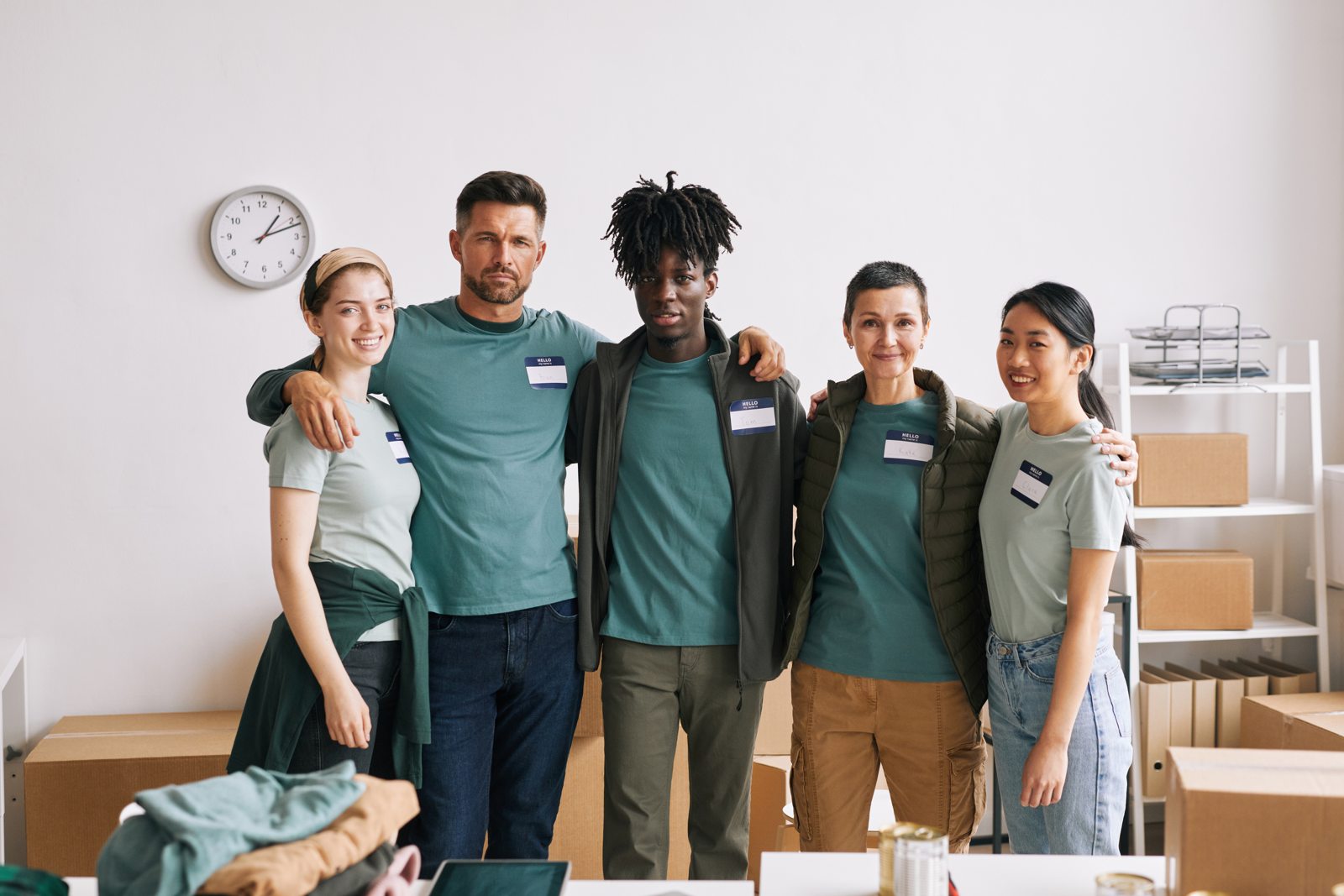 Diverse volunteer team standing together for a group portrait