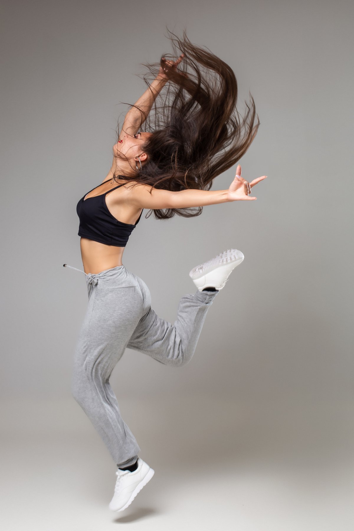 Modern dancer jumping with flowing hair