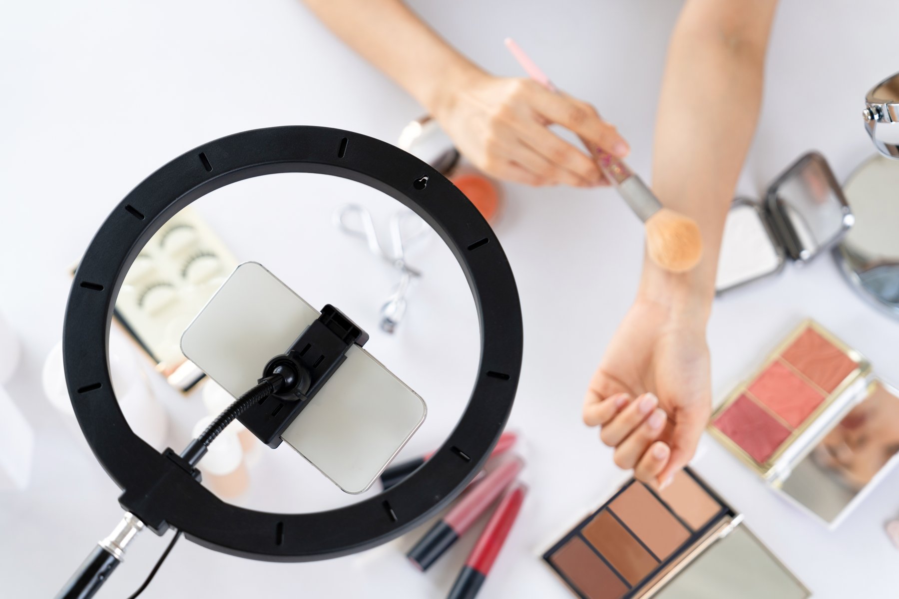 An overhead camera setup recording a beauty tutorial