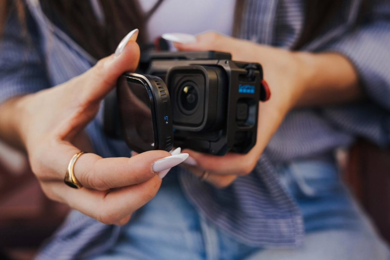 A PolarPro close-up diopter being fitted over a GoPro MISSION 1 series camera lens