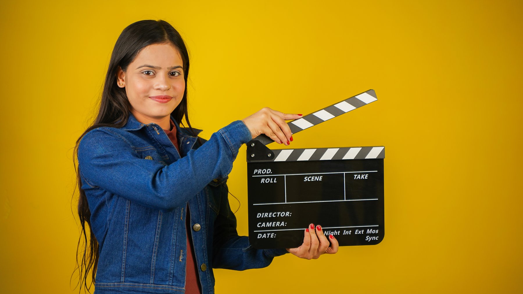 Performer holding a clapperboard