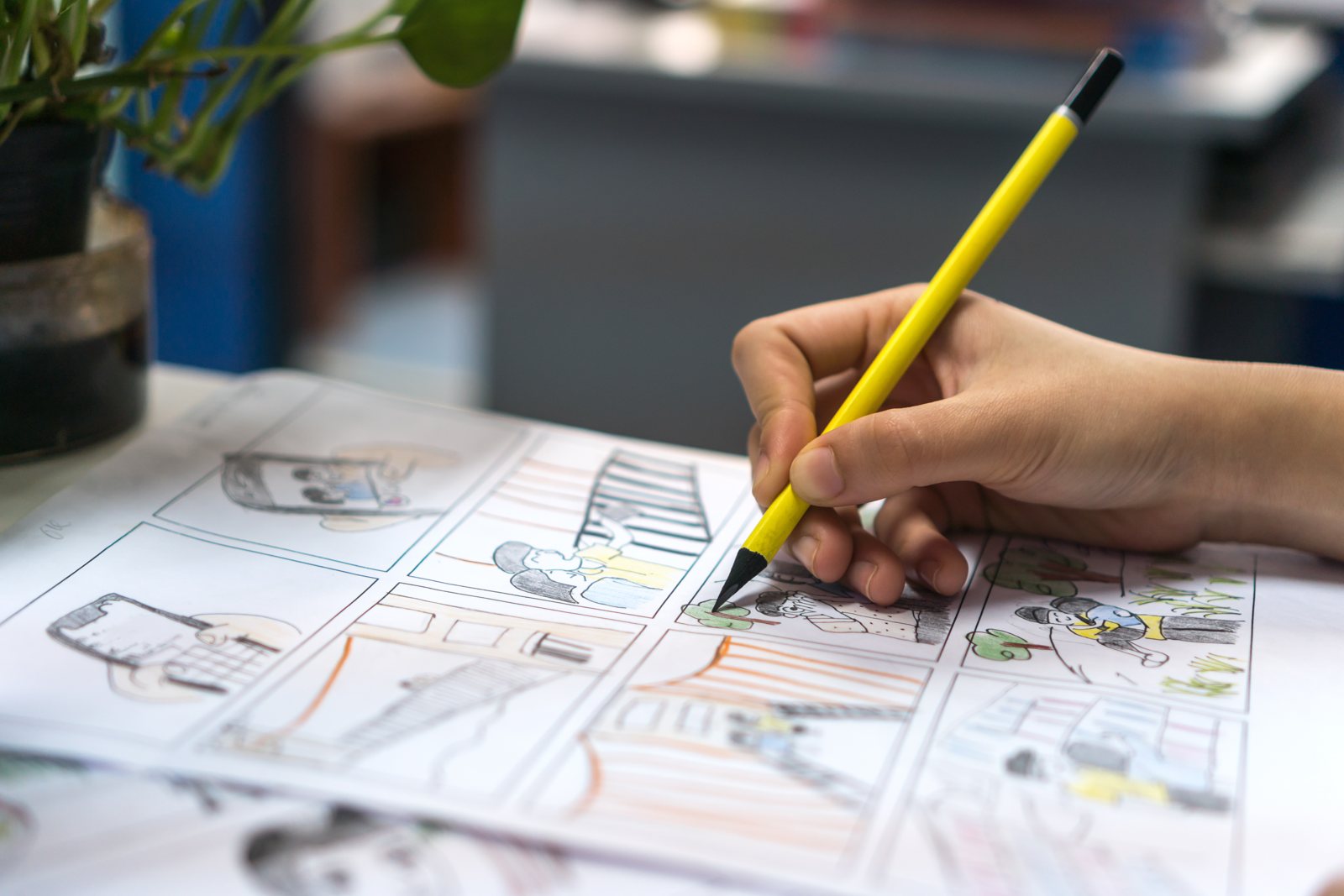 Hand drawing panels on a film storyboard