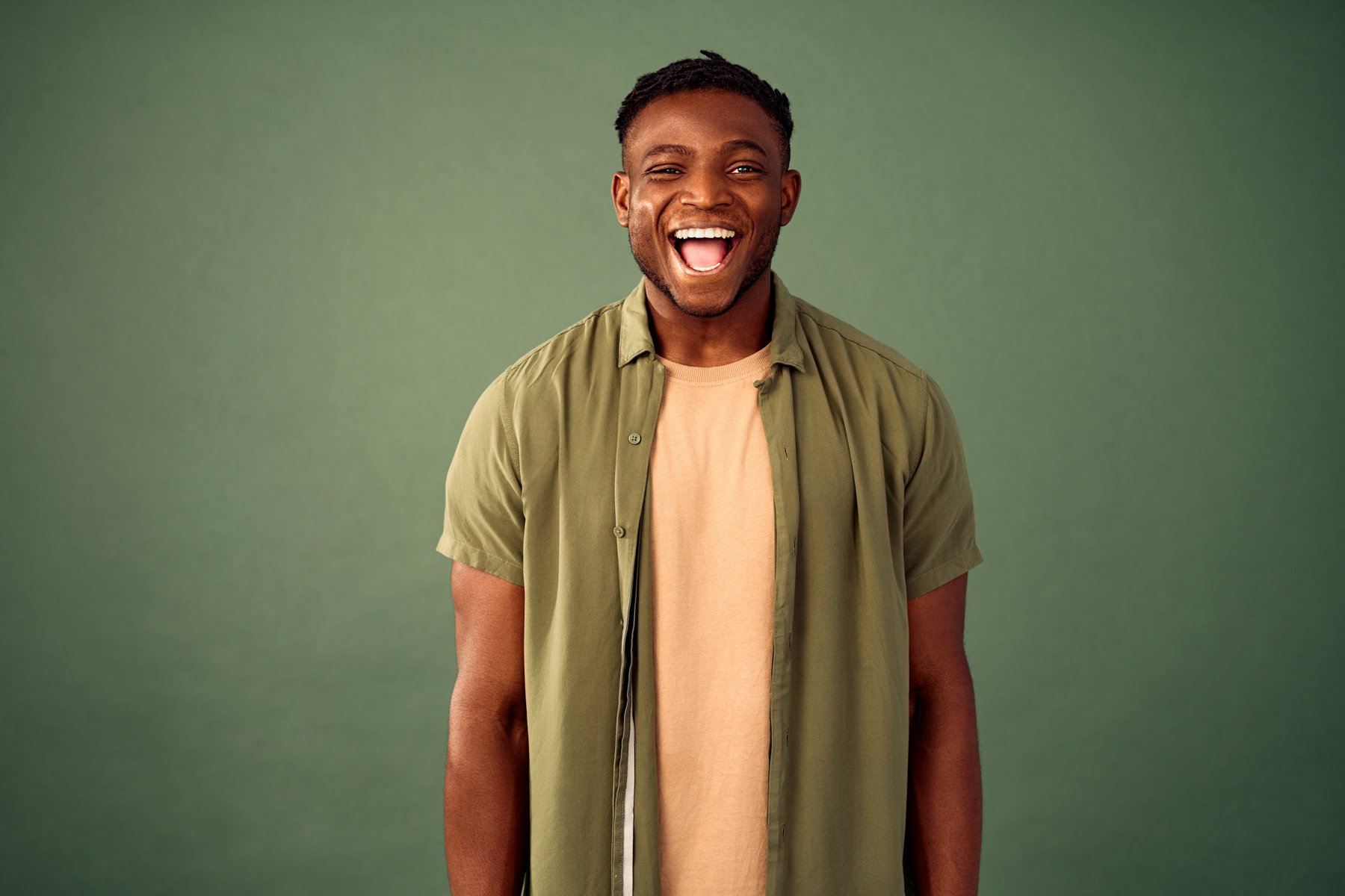 Relaxed model expression against a green background