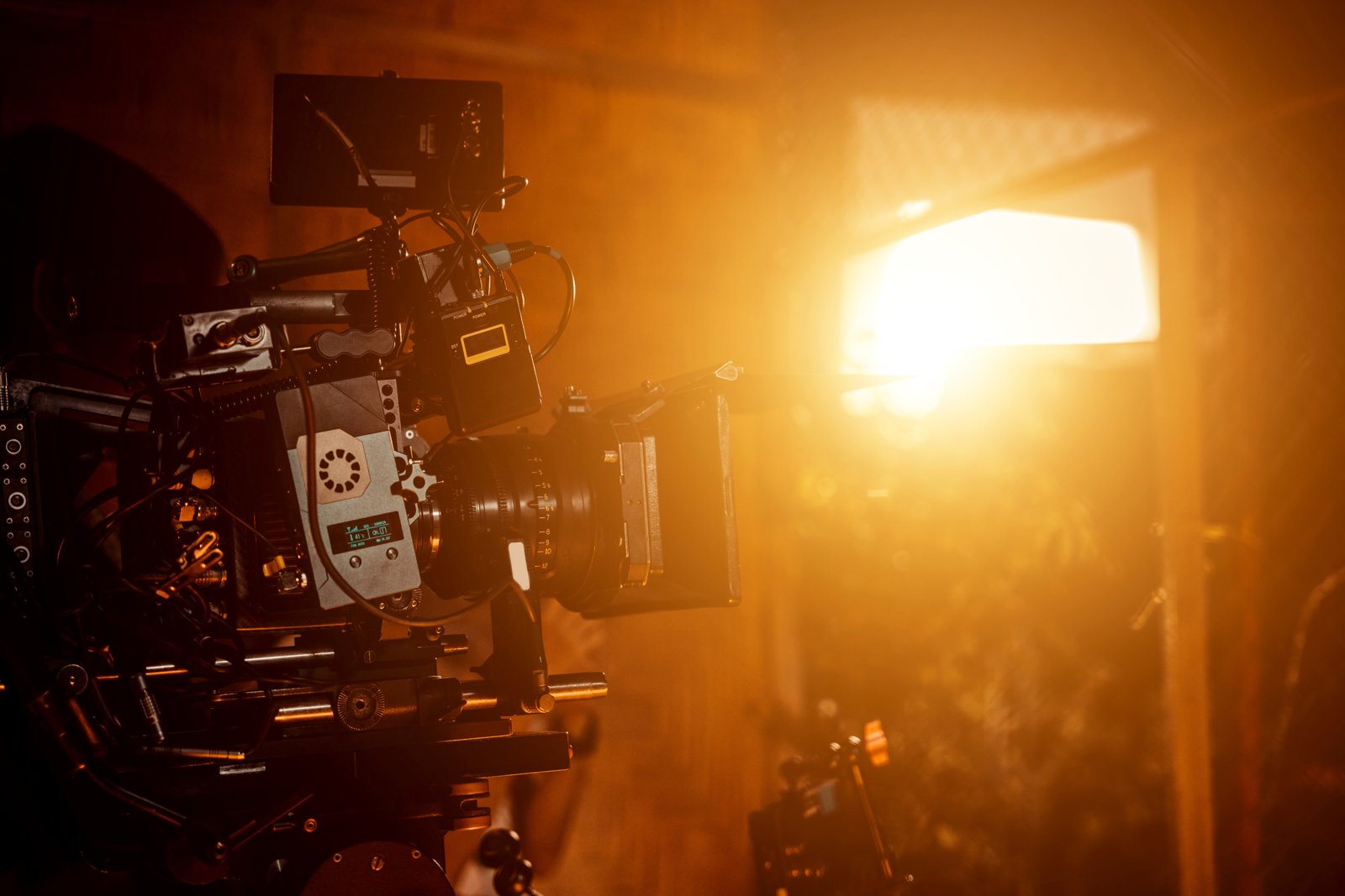 Filmmaker preparing a camera on a production set