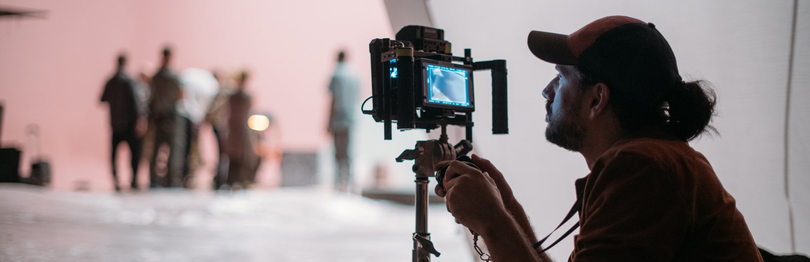 Focus puller checking the camera image during production