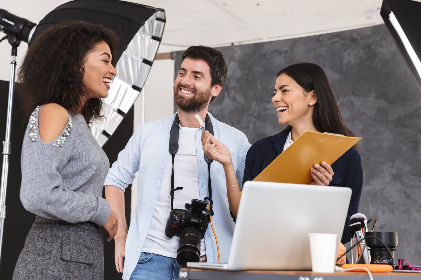 Photographer and creative team talking through a studio shoot