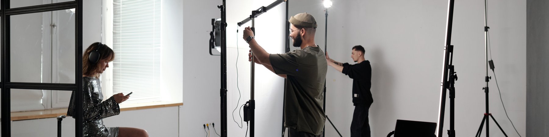 Production crew setting lights and camera equipment before filming