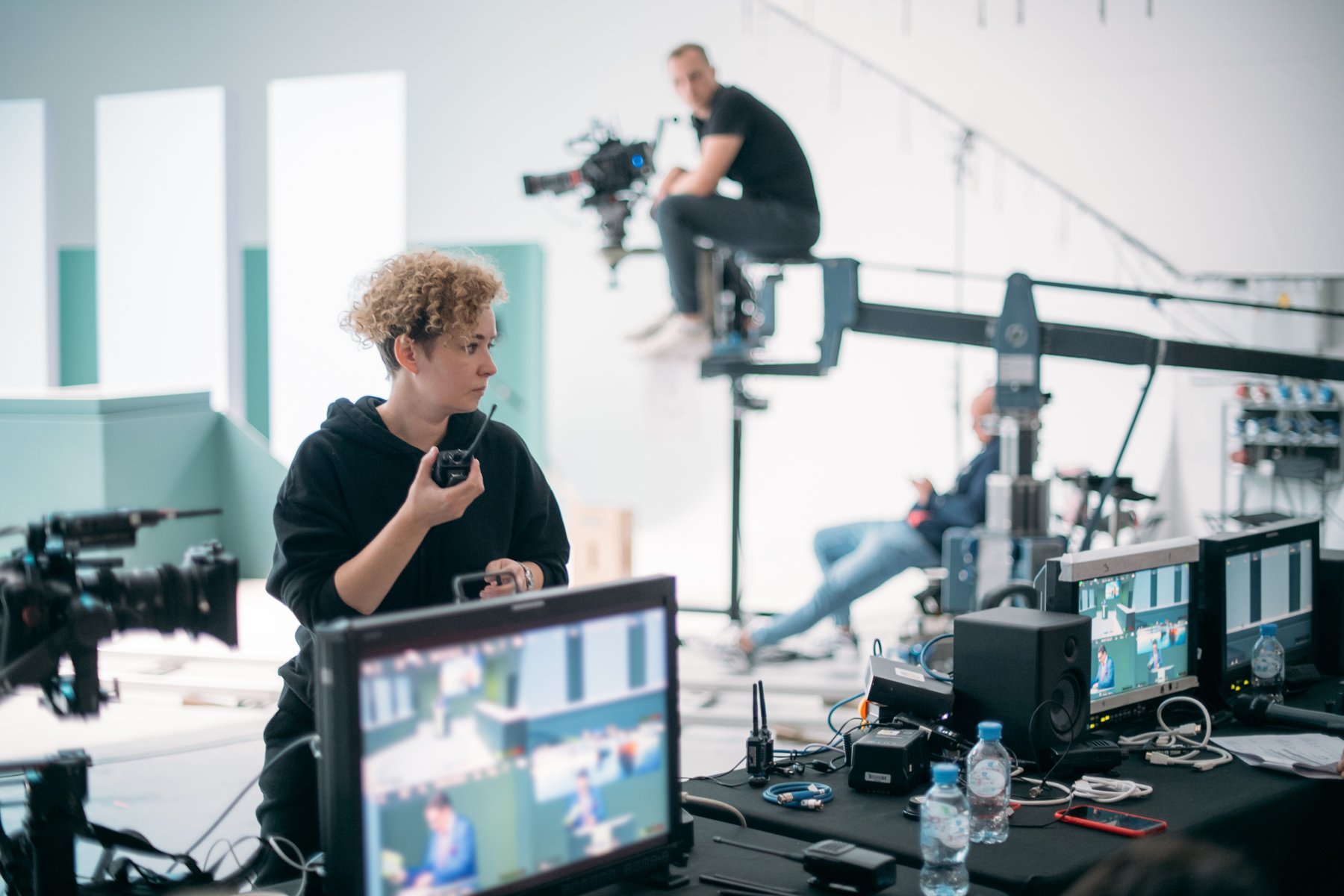 Director reviewing a film scene on production monitors